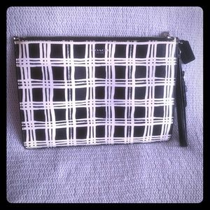 Coach wristlet / pouch with card slots.